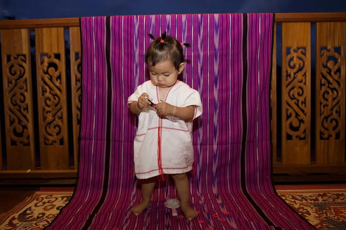 A young Karen child in traditional dress